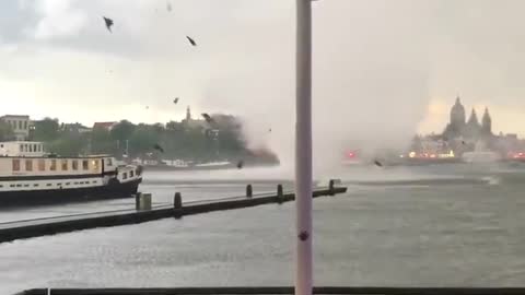 Crazy strong vortex winds startle tourists in Amsterdam