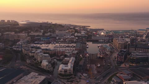 Aerial shots of seaside cities as night falls