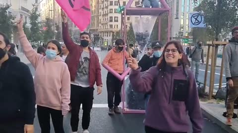 Police attempt to disperse Extinction Rebellion protesters blocking roads in Madrid