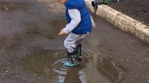 4 years old boy playing with water