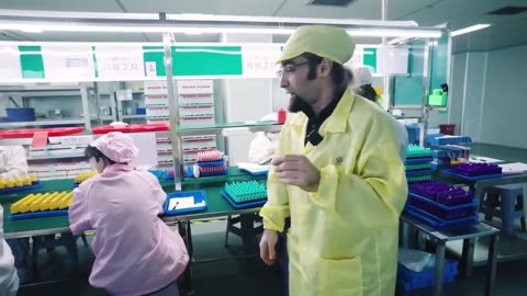 Worker at a disposable vape factory tests