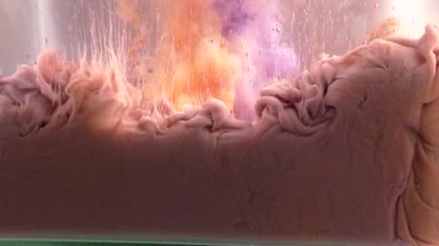 paint in water video orange vs purple