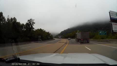 Car Almost Wiped out by a Big Rig