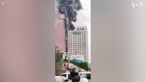 Fire Engulfs Skyscraper in Southern China