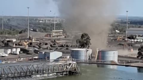 Person filming a whirling Dust Devil and while working