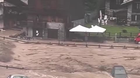 Cars washed down road as huge floods hit Italy and Switzerland