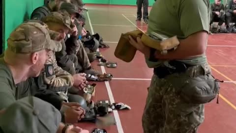 Ukrainian soldiers hang out in schools. One x US hat spotted.