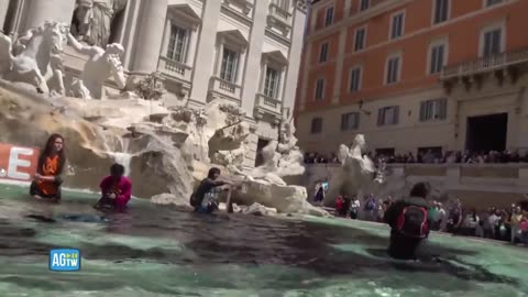 Radical climate change activists defile Trevi Fountain in Rome with black dye