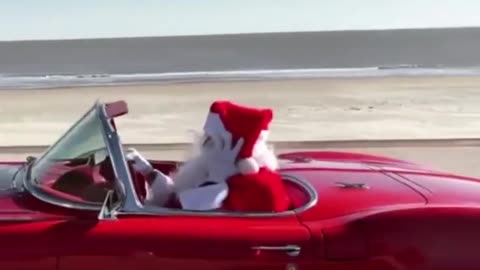 Santa Spotted Out On The Road In A Fancy Red Car