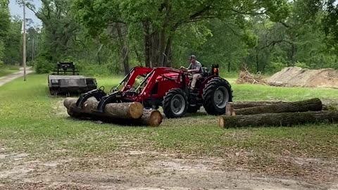 Massey Ferguson Lifting Logs