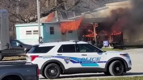 Car Pulls in Front of Flashing Fire Truck