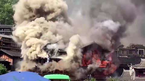 Fire engulfs village building in southern China