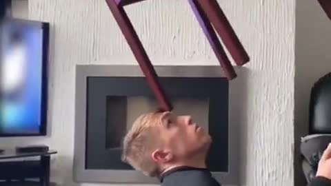 Guy Balances Random Heavy Objects on His Face