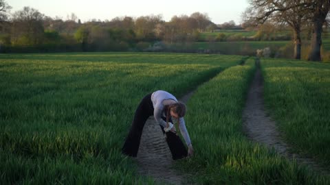 aesthetic yoga on a field 🙆🏽‍♀️🤍