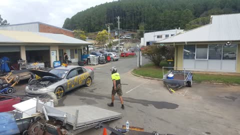 Car Jumps Over Pile of Junk