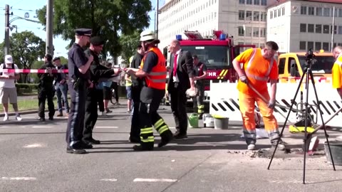 German climate protester glues hand to street