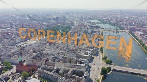 Inscription on video. Copenhagen, Denmark. Central historical part of the city, city roofs and Copen