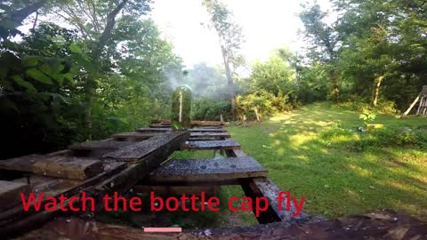 Watch the bottle cap fly