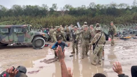 Texas National Guard managing migrants using riot shields in Eagle Pass, TX - Video 2