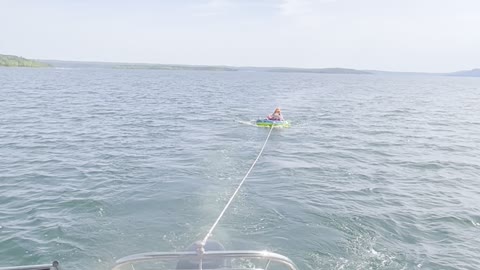 Granddaughter riding tube