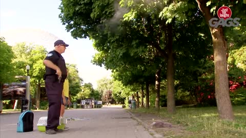 cop shoots cat off of tree