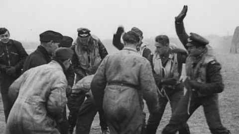 Men of JG 26 commanded by Adolf Galland enjoy a bit of horseplay before scrambling their Bf 109 Es