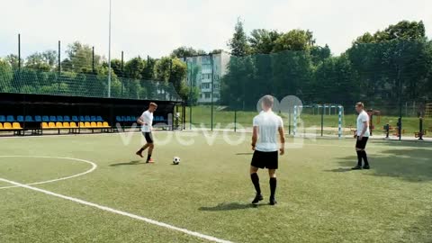 Male Soccer Player Doing A Throw In And Then Joining His Team On A Street Football Pitch