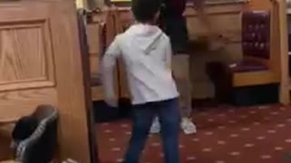 Kid has floss dance-off with member of restaurant staff