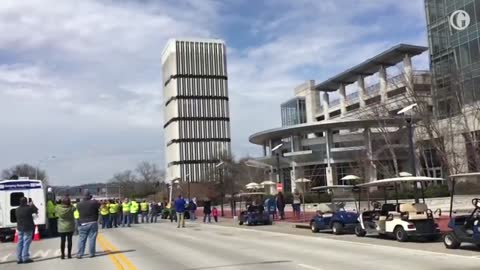 Crowds watch as tallest building in Kentucky's capital is demolished