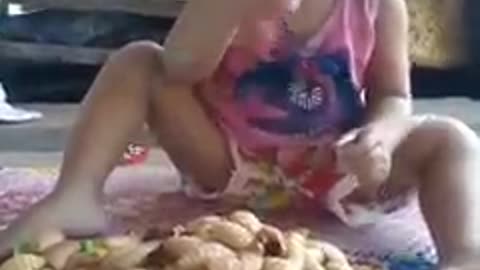 TODDLER EATING WORM