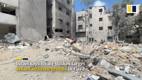 ‘He’s all that’s left’: Gaza father grasps infant son after Israeli air strike wipes out family