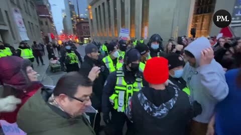 Freedom protestors in Ottawa chant “Freedom” and sing O Canada while police try to stop them from building a tent. Police allowed them to build it provided it doesn’t block the emergency lane