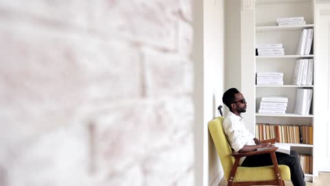 A Man Reading Using Braille