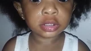 Granddaughter Ja'Liyah greased herself down with black grease