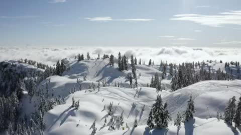 Snowy hills with clouds