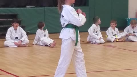 Ellie performs her purple belt test