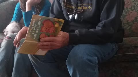 Papa Reading Childrens Book to Paul