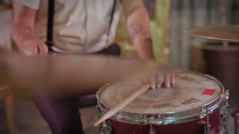 Drummer playing with great technique in a close view