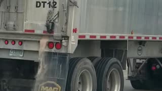 Semi Spilling Sand on the Street