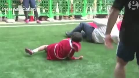 Boris Johnson knocks over boy in rugby match in Japan