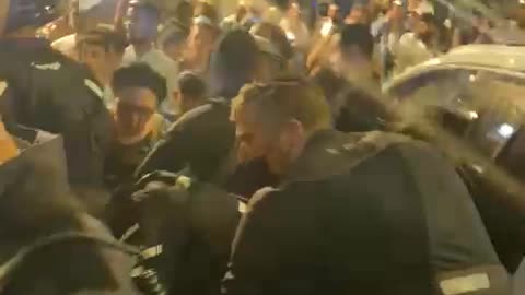 Gestapo violently arresting a demonstrator in Jerusalem