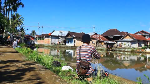 fishing in the village with a simple pond