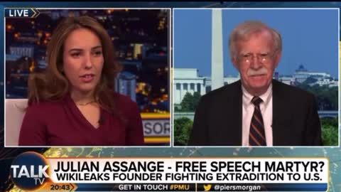 Julian Assange’s Wife Calls Bolton a War Criminal to His Face!