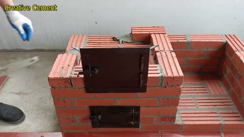 Outdoor wood stove from red brick and cement