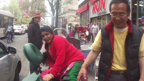 Luodong Briefly Massages Mature Indian Woman In Massage Chair On Sidewalk