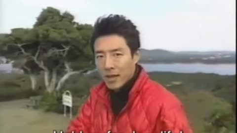 Japanese man giving motivational speech.