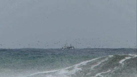 Fishing Boat Sailing on a Stormy Ocean