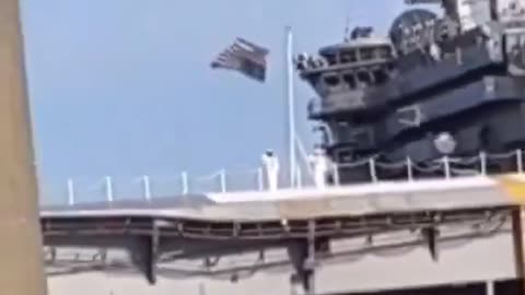 American flag flying upside down on a US Navy Ship 10/22023