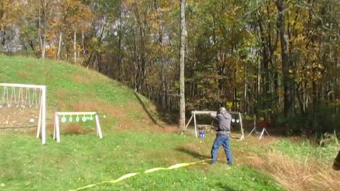 Watch those .45 slugs DESTROY the hanging plates!