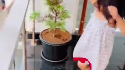 A cute Small girl dancing on streetside drum beat